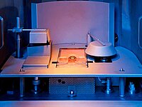 Close-up of an industrial machine interior with mechanical components and sensors