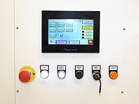 Control panel with touchscreen interface and multiple buttons on industrial semiconductor equipment.