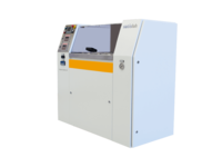 Compact industrial machine with control panel and protective cover used in semiconductor processing.