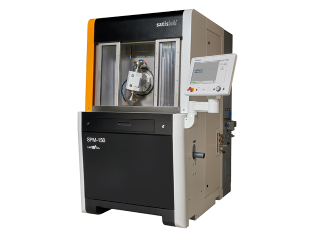 Frontal view of Satisloh SPM-150 grinding machine used in precision optics manufacturing.