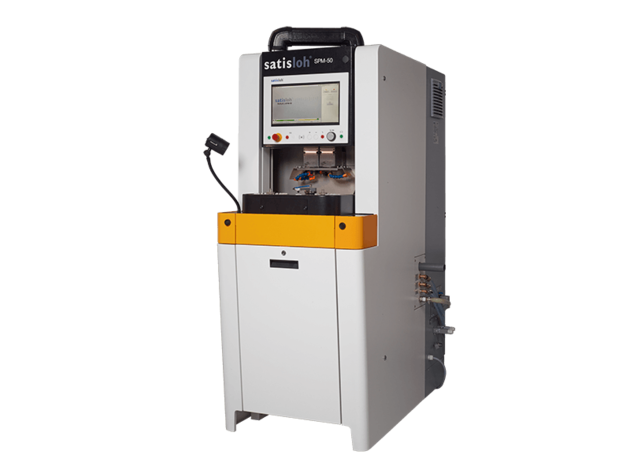 Frontal view of Satisloh SPM-50 grinding machine used in precision optics manufacturing.
