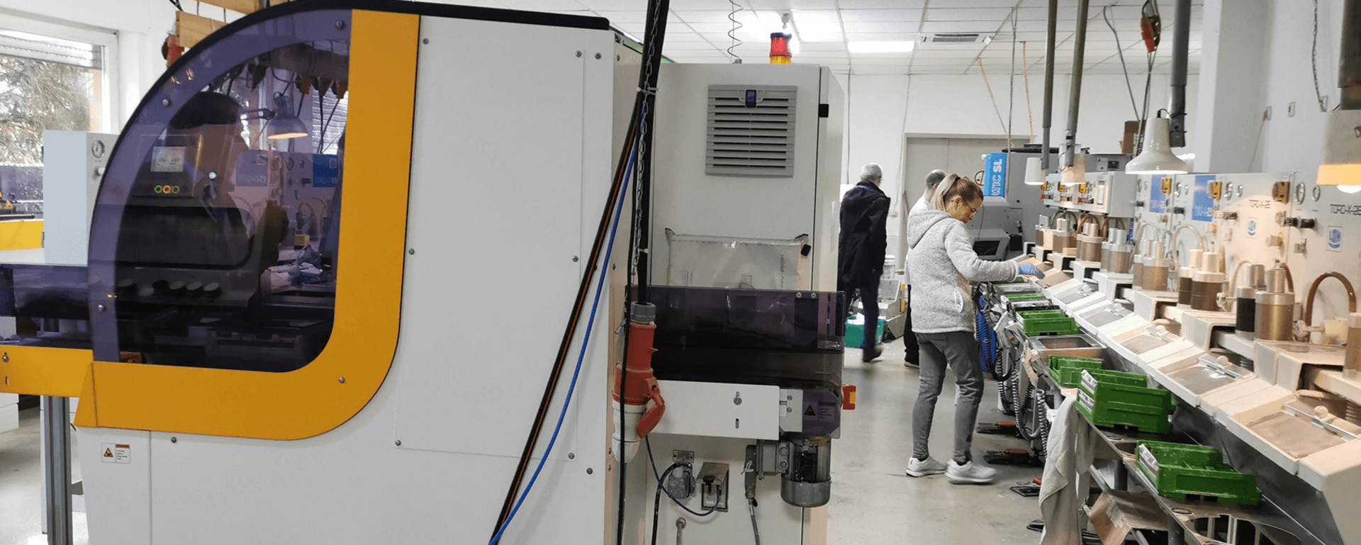 View inside a customer lab with multiple Satisloh machines.