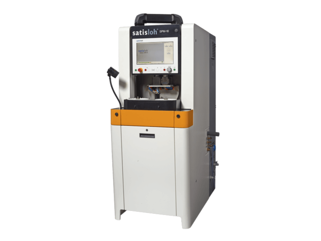 Frontal view of Satisloh SPM-10 grinding machine for micro optics used in precision optics manufacturing.