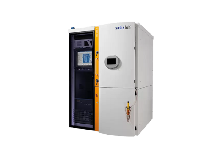 Industrial vacuum coating machine with touchscreen control panel, used for optical lens production.