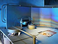 Interior of industrial machine with mechanical components, levers, and flat working surface