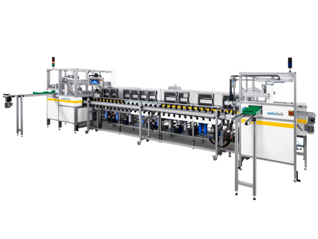 Industrial assembly line machine with multiple workstations for automated semiconductor or electronics production.