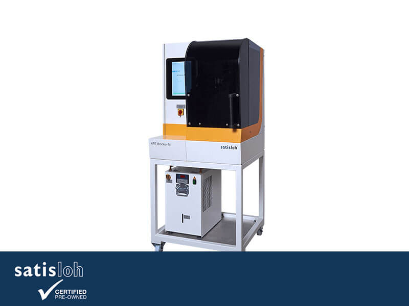 Compact laboratory testing machine with touchscreen control and enclosed chamber.