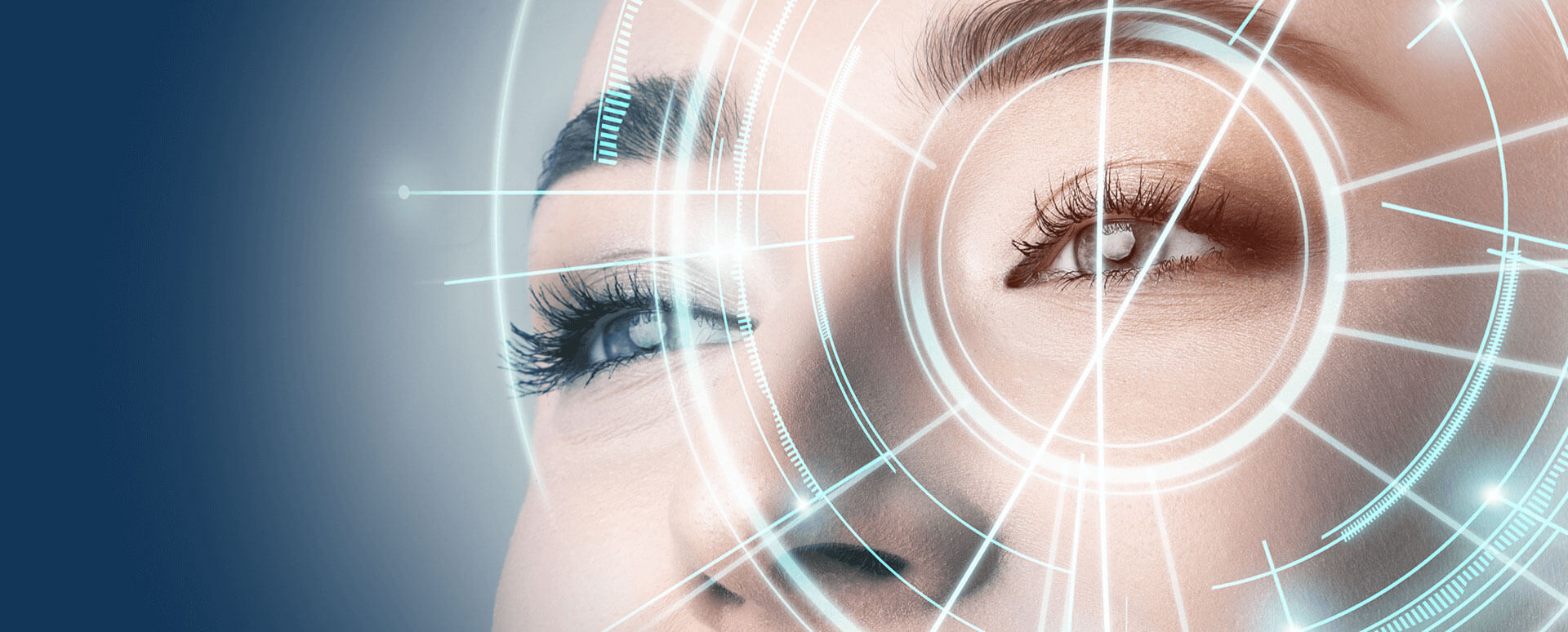 Lens Design Technologies Close-up of a woman’s eye with digital circular interface graphics overlayed, symbolizing biometric scanning or augmented reality technology.